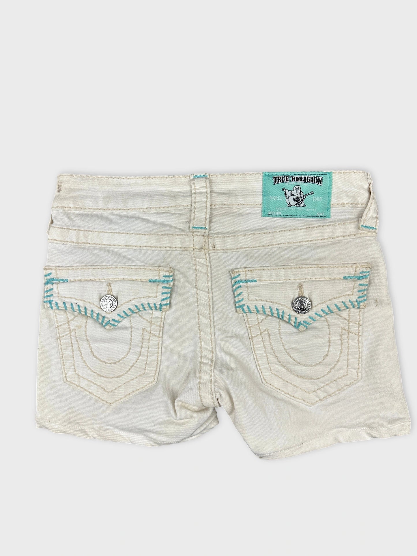 Back view of white denim shorts featuring detailed turquoise stitching.