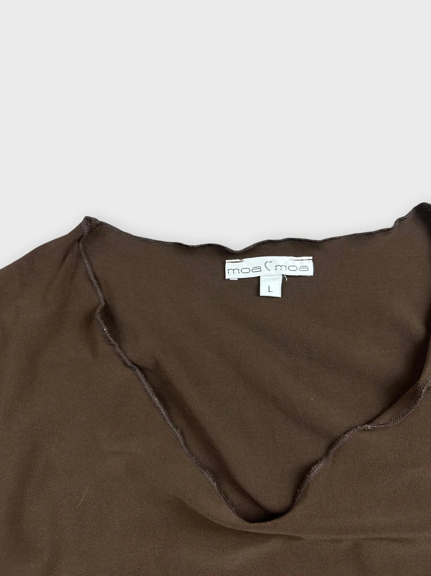 detail view of a brown slim crop top with a v-neckline