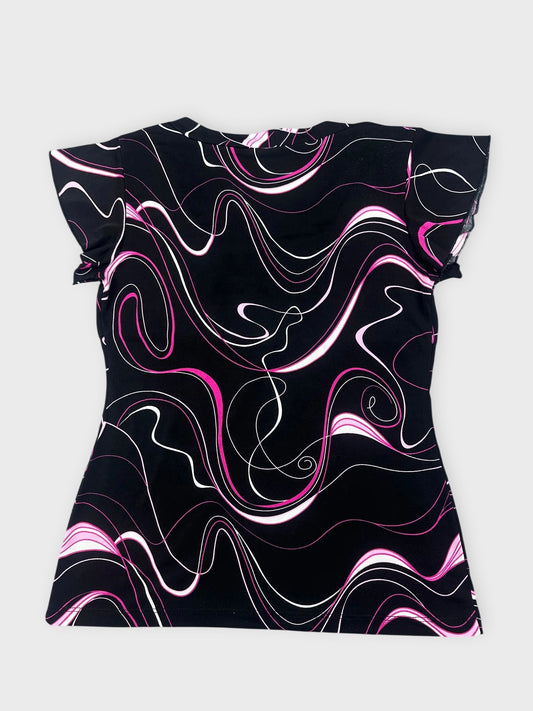 Back view of swirled graphic top in black with pink and white patterns.
