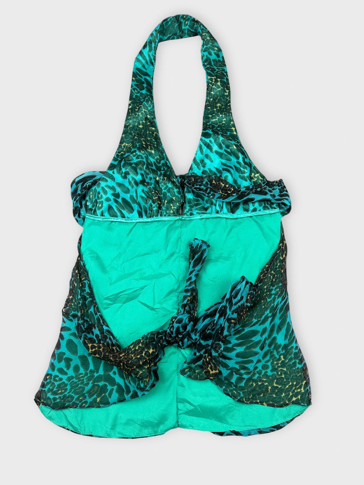 Back view of teal leopard print top with ruched detail.
