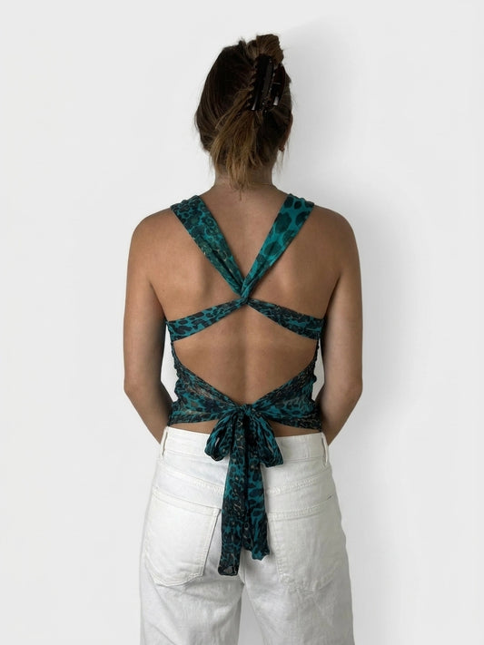 Back view of teal leopard print top with ruched detail and tied waist.