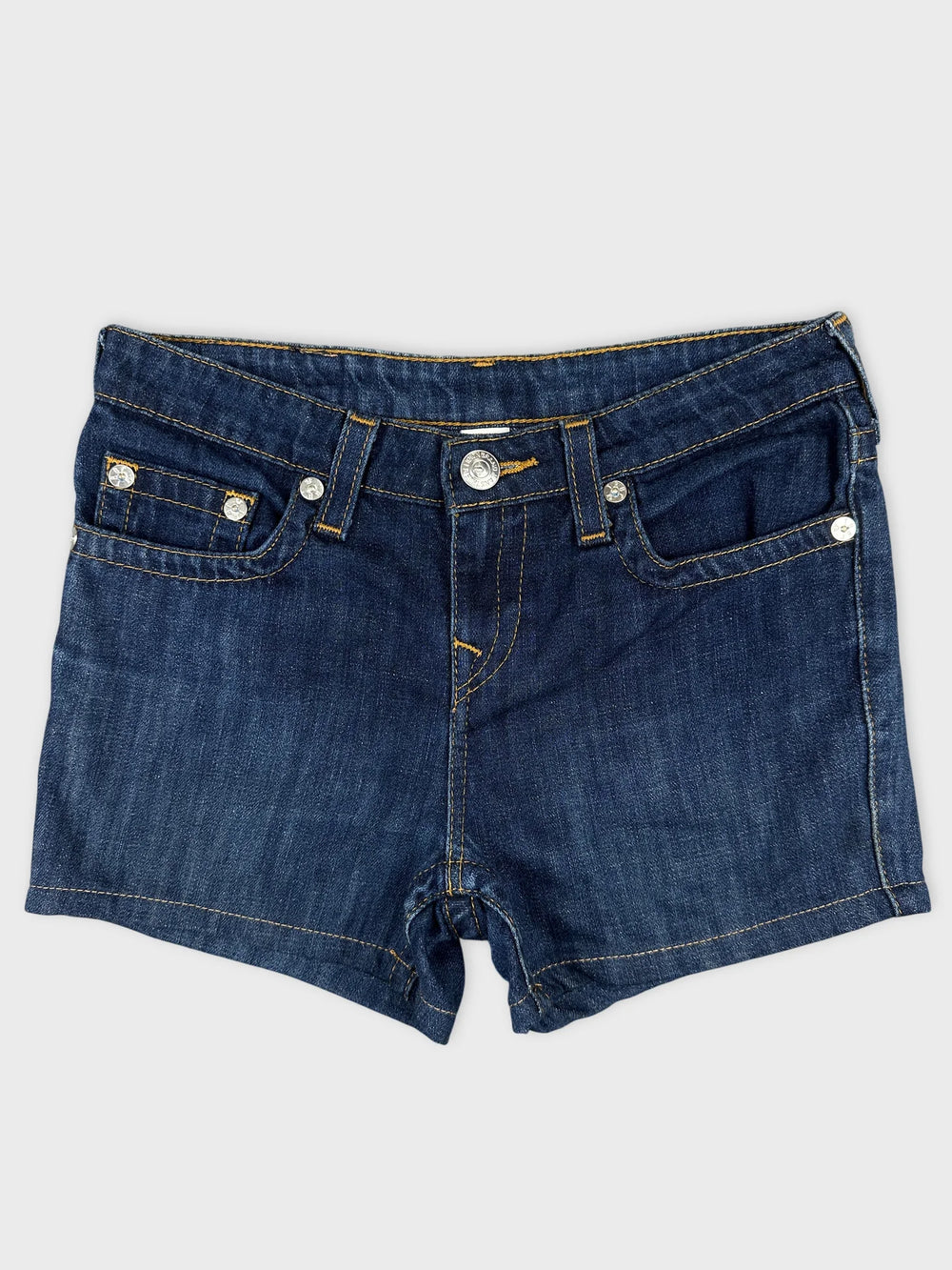 Front view of denim shorts in classic blue with pocket detailing.