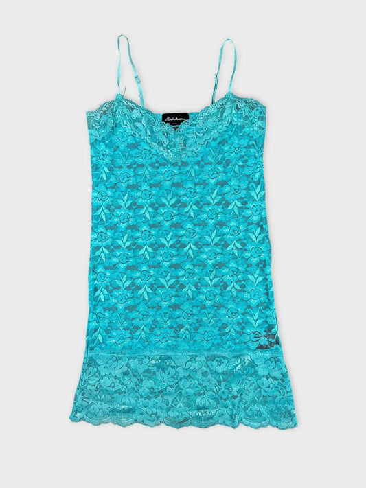 Turquoise lace top with delicate straps front view featuring floral pattern and scalloped hem.