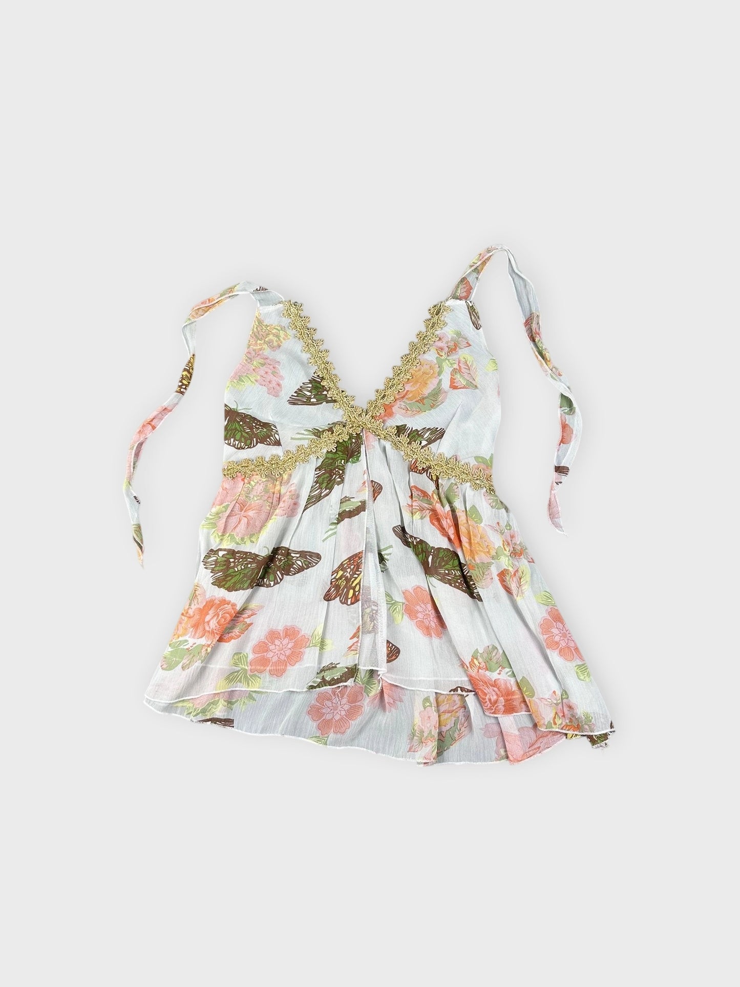 Detail view of a vintage floral butterfly cami in light blue with lace trim.