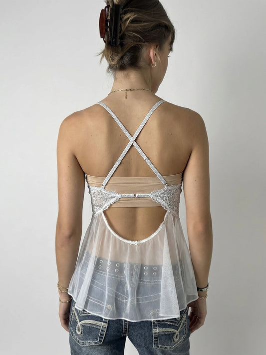 Back view of a white sheer lace camisole with a low cut and sparkly details.