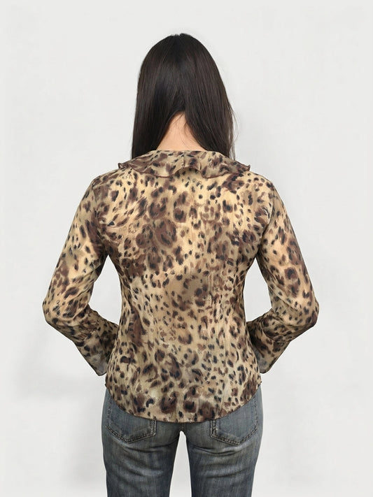 Back view of a wild print wrap top featuring ruffles and a brown leopard pattern.