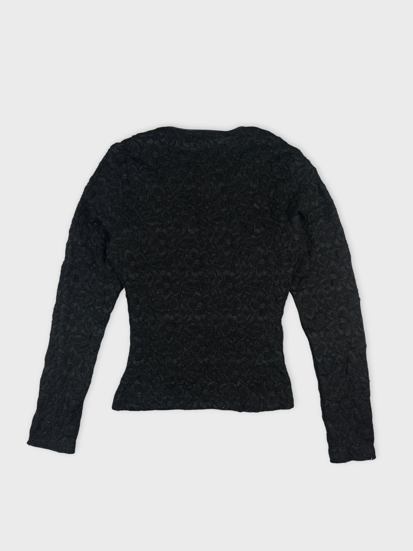 Back view of black long-sleeve body shirt with lace pattern.