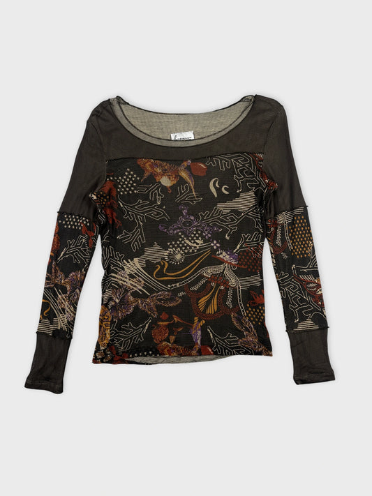 Detail view of a black long-sleeve body shirt with floral print.