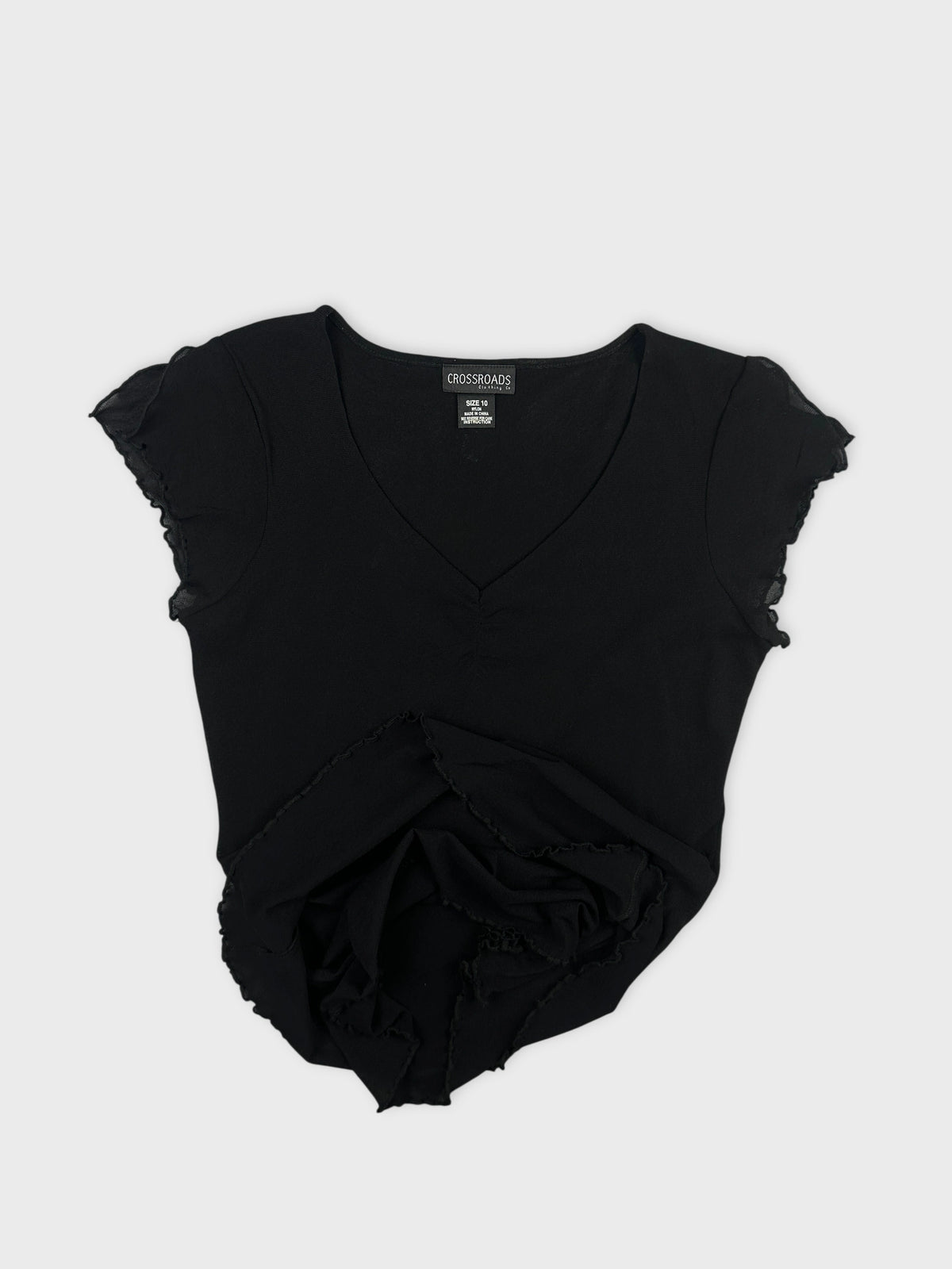 Black body shirt with ruffled sleeves detail view
