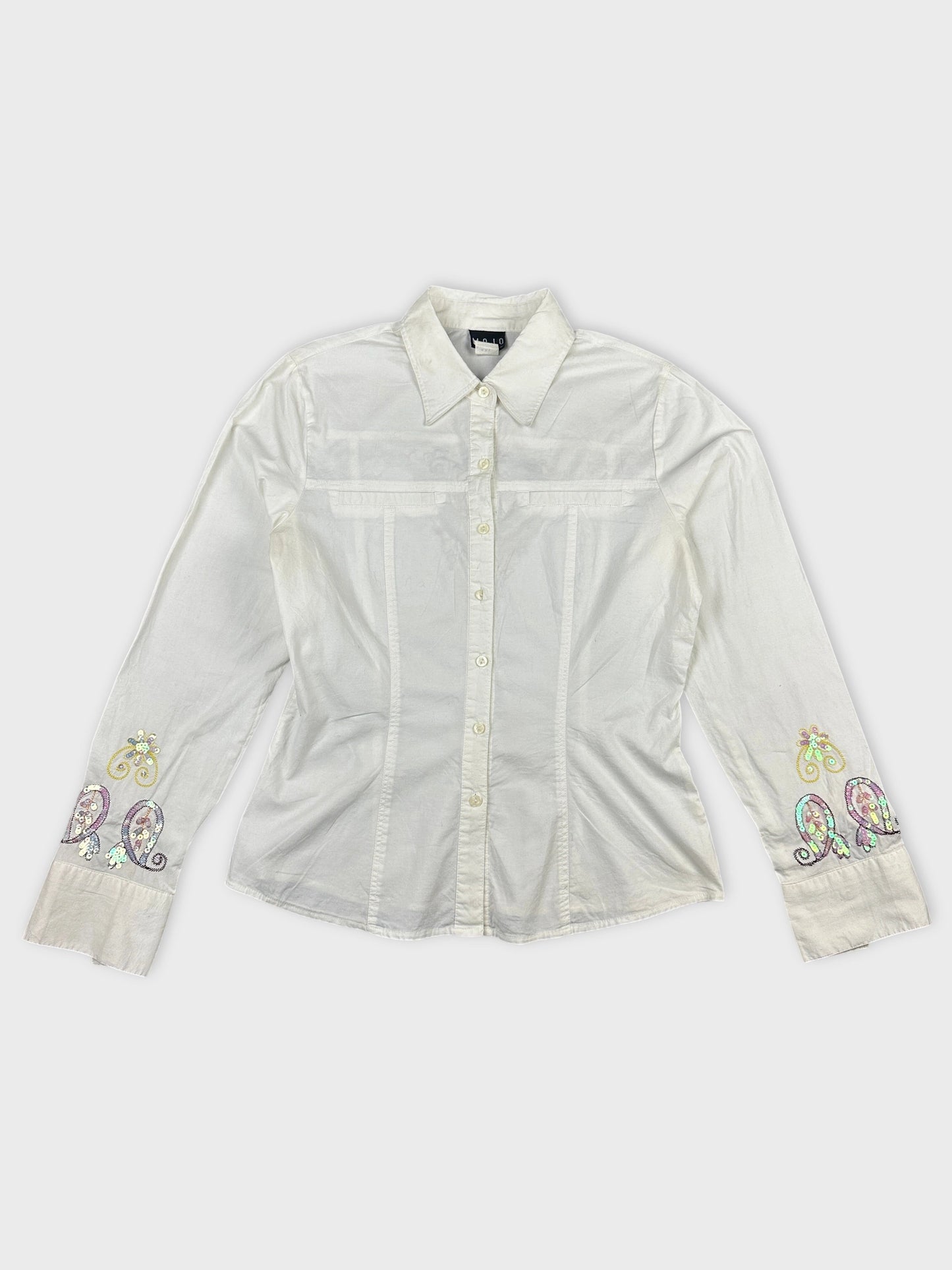 Front view of a white body shirt with embroidered paisley details on sleeves.