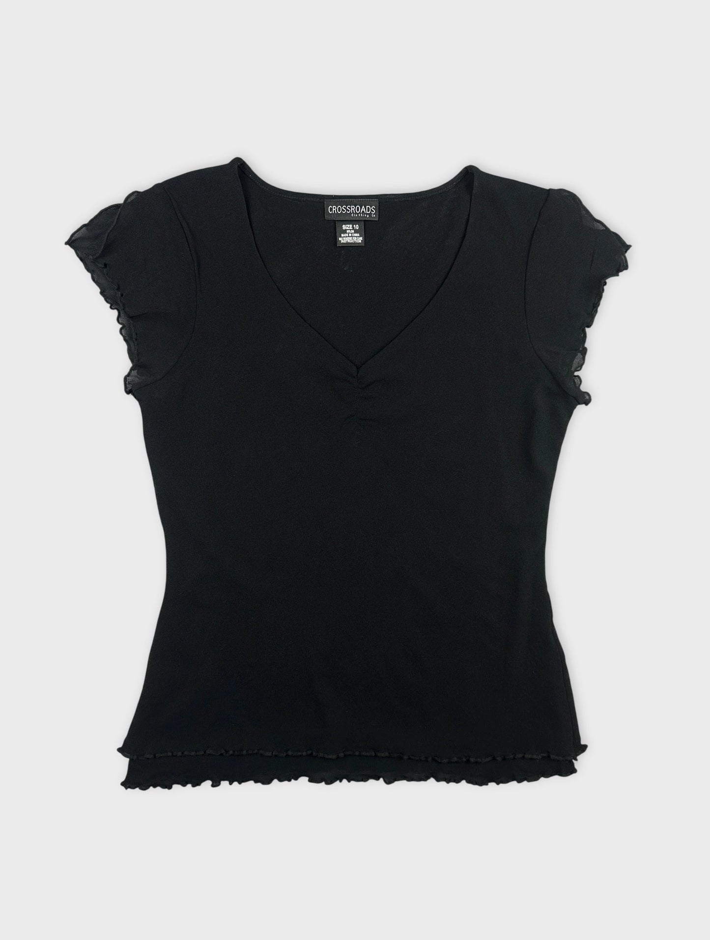 Black body shirt with ruffled sleeves front view