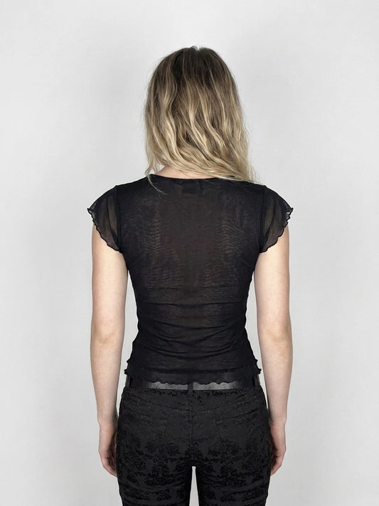 Back view of a black women's body shirt with frilled sleeves.