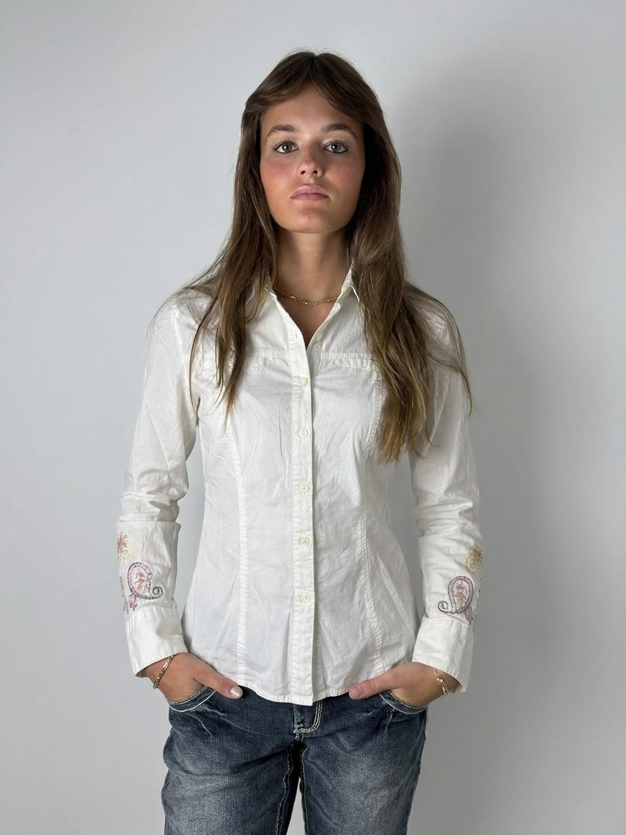 White body shirt with colorful embroidery, shown in front view.