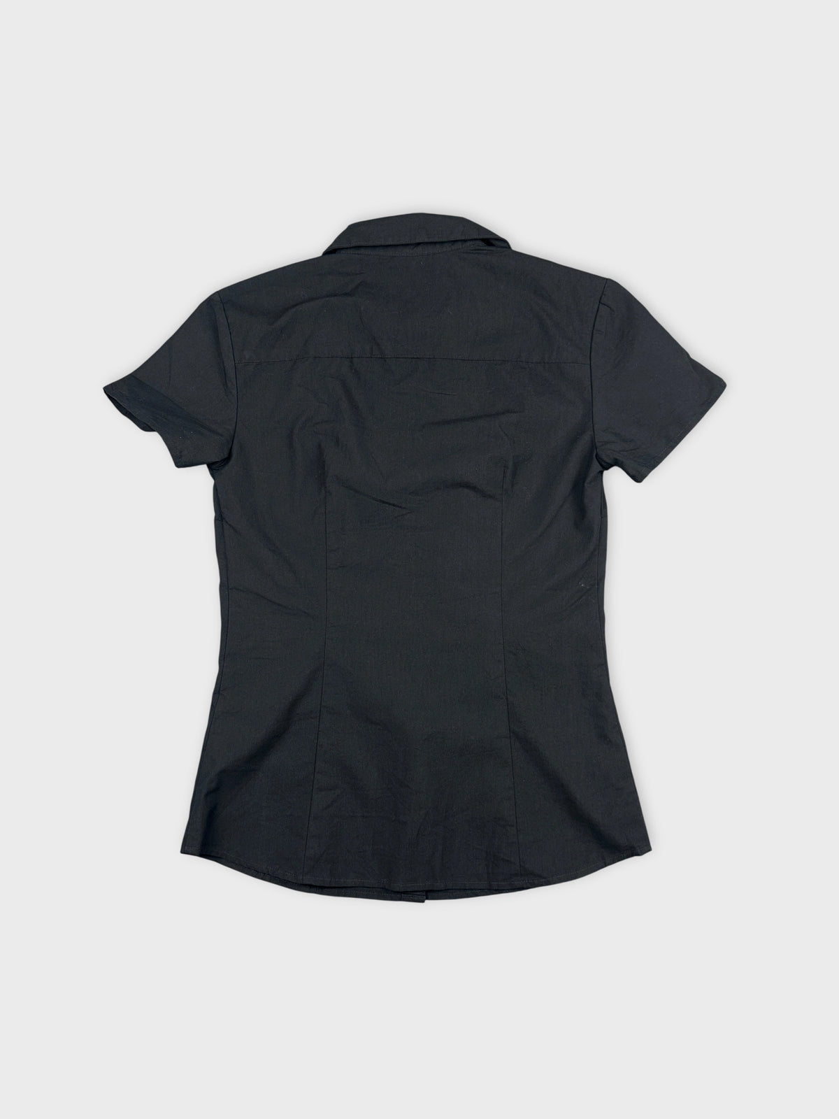 Back view of a black women's body shirt with a collar.