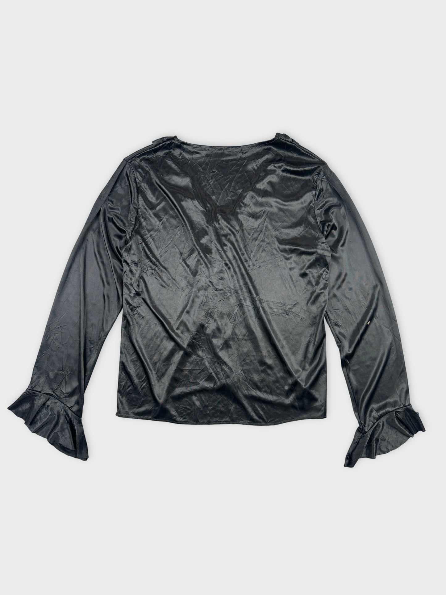 Back view of black body shirt featuring ruffled sleeve details.