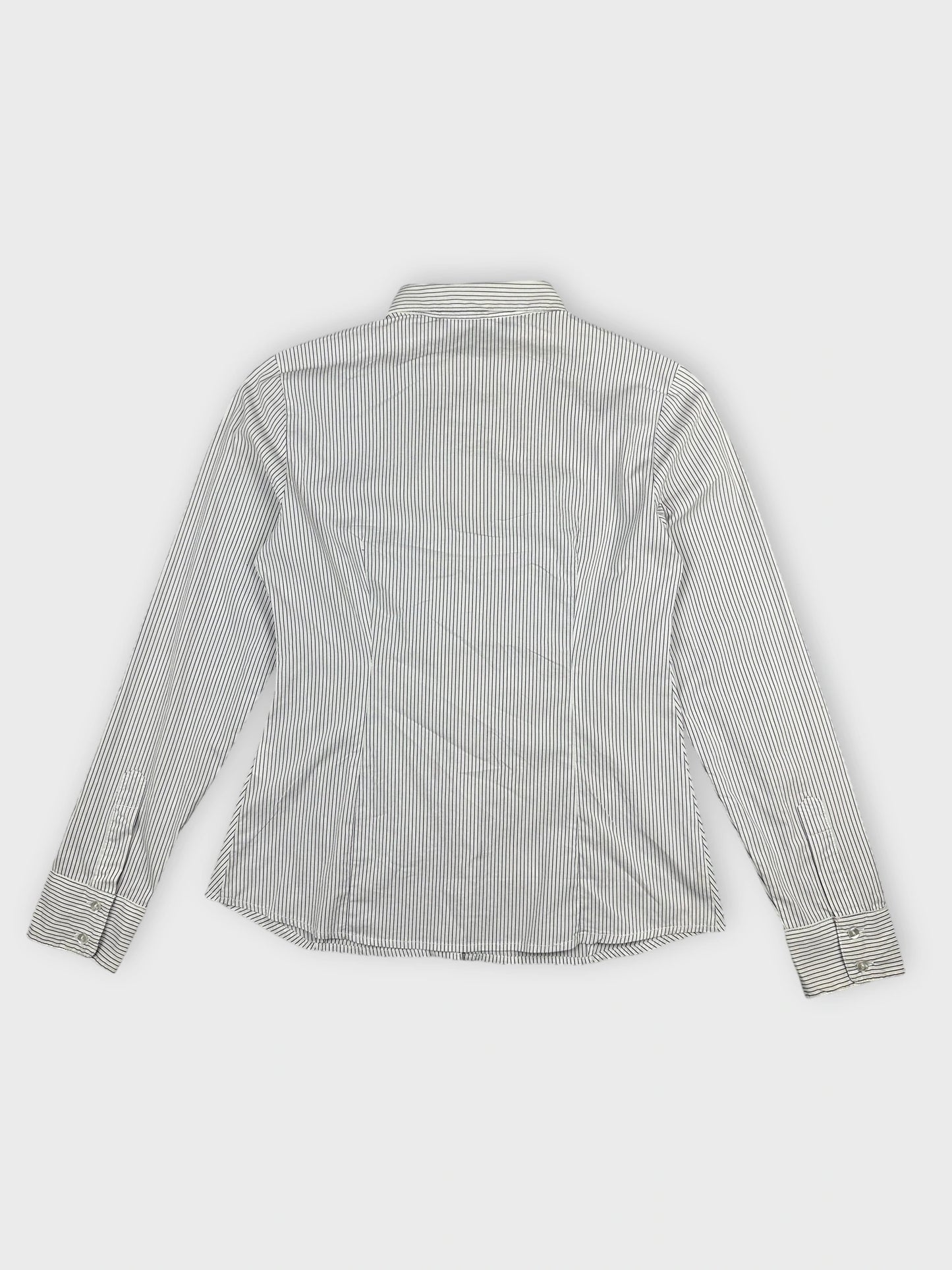 Back view of a women’s body shirt in white and navy striped pattern.