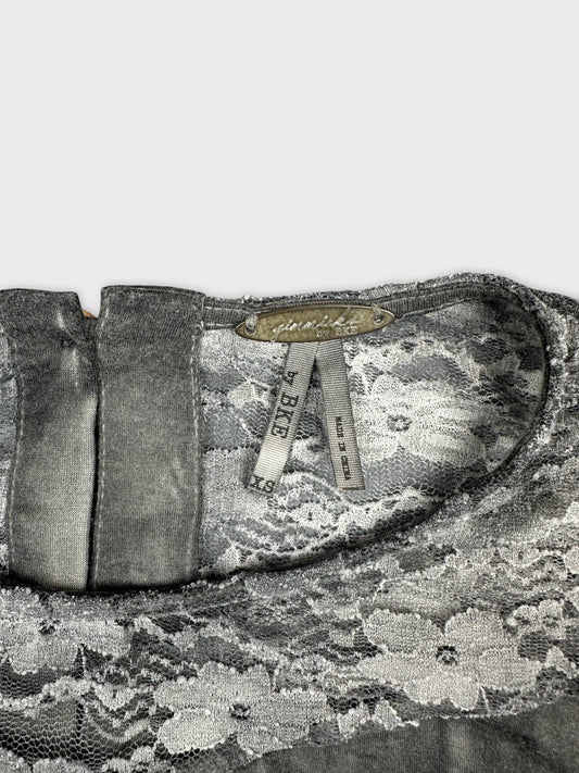 Detail view of a grey lace body shirt featuring a keyhole back.