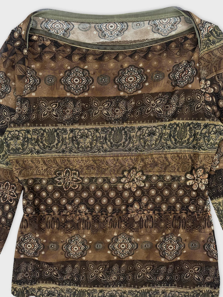 Detail view of a vintage women's body shirt in earthy brown with intricate patterns.