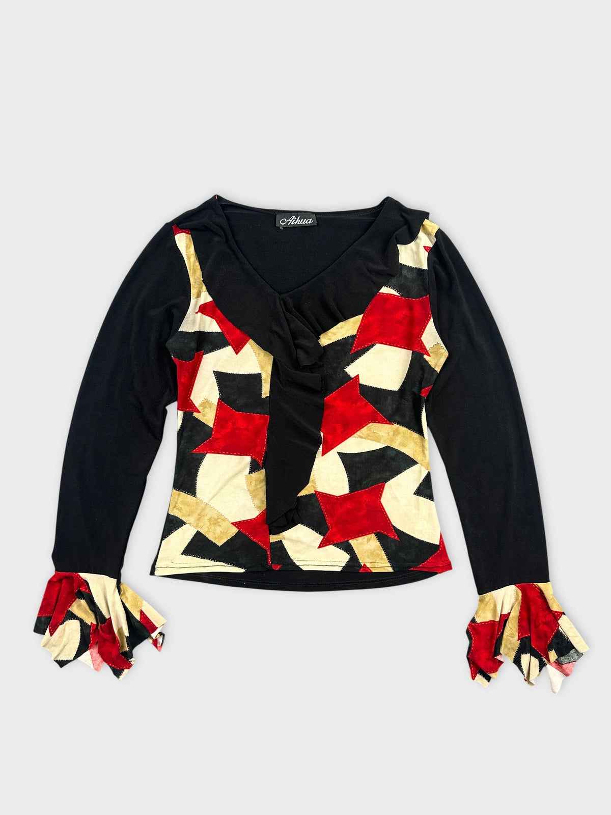 Front view of a vintage body shirt in black with red and gold geometric patterns.
