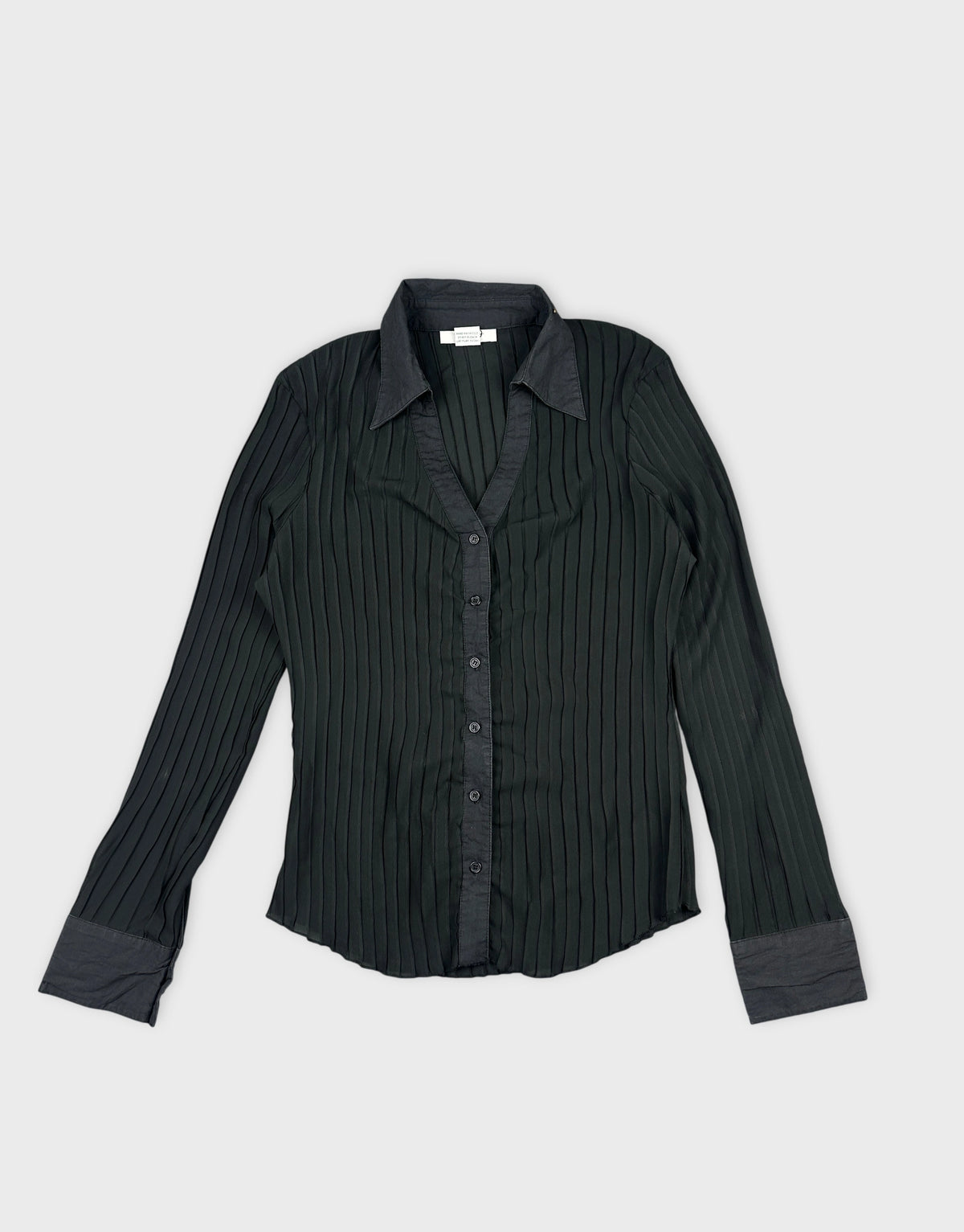 Front view of a black ribbed women’s body shirt featuring a collar and button closure.