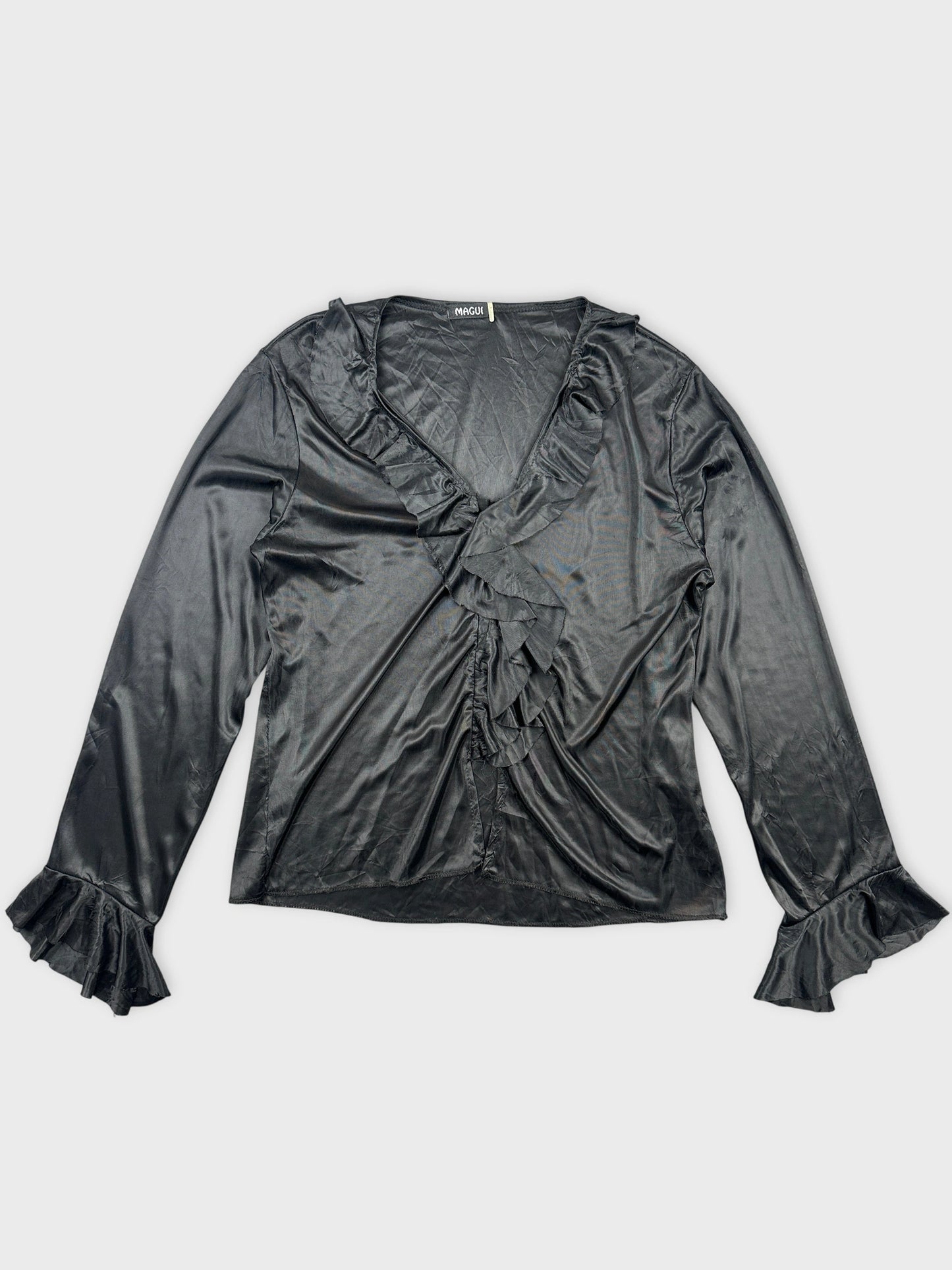Black body shirt with ruffled trim in front view