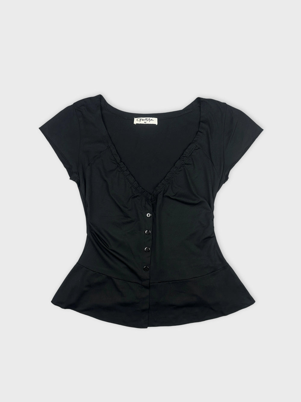 Black body shirt with ruffled neckline front view