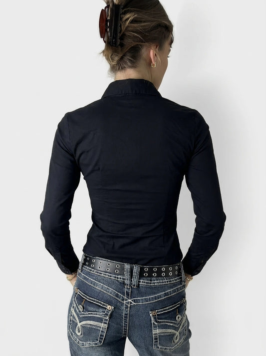 Back view of a women's body shirt in navy, featuring a fitted silhouette.