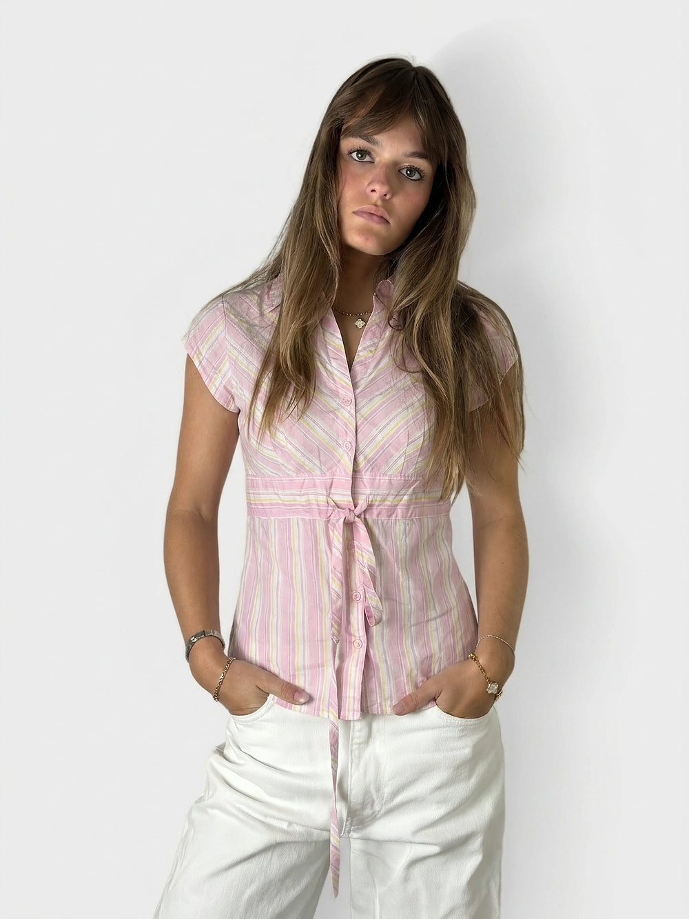 Front view of a pink striped women's body shirt with a tie detail.