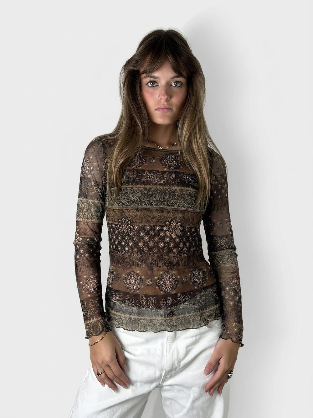 Front view of a brown body shirt featuring intricate floral patterns.