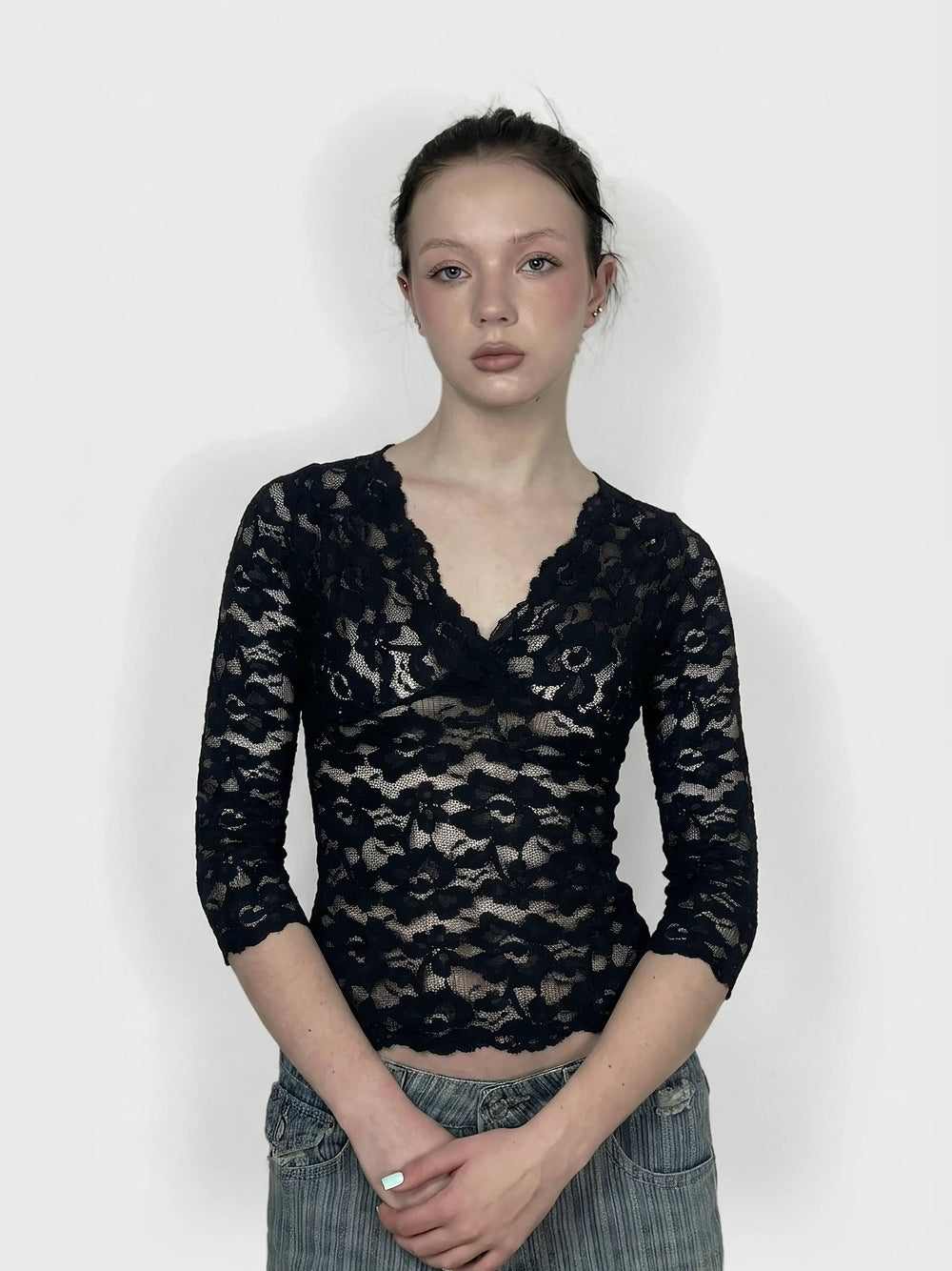 Navy lace body shirt with a scalloped neckline, front view.