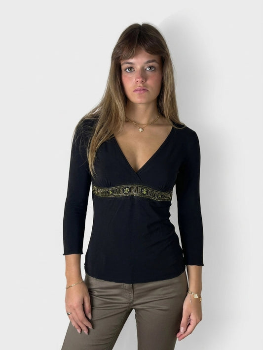 Women’s black body t-shirt with green decorative trim, front view.
