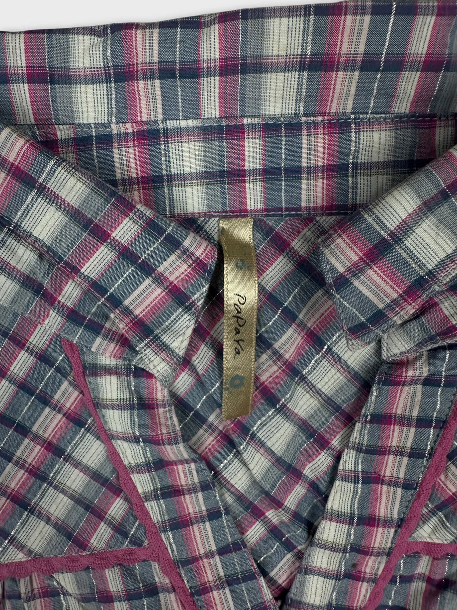Detail view of a women's plaid T-shirt in navy and pink colors.