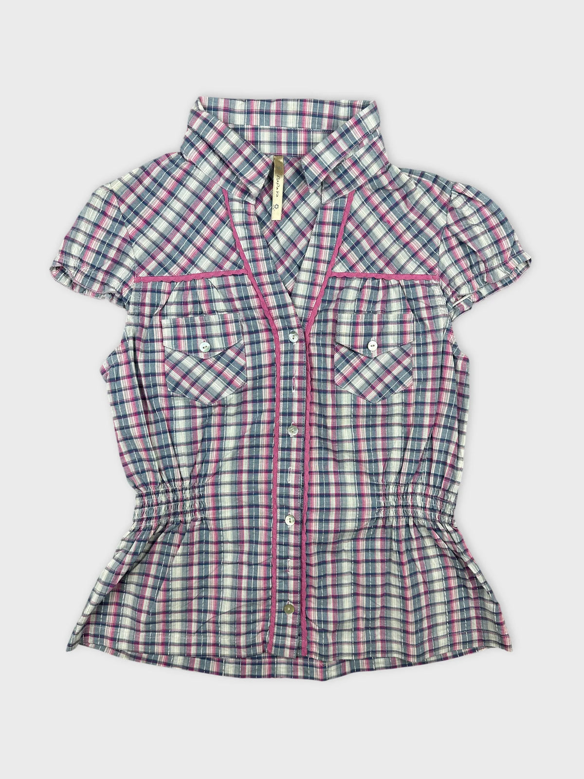 Front view of a short-sleeve plaid shirt with pink trim and buttons.