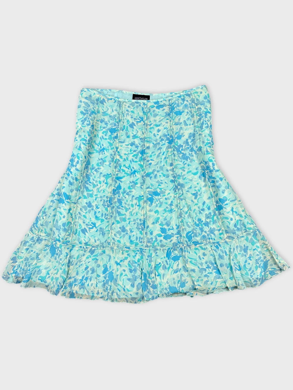 Front view of a flared dress in light blue floral print.