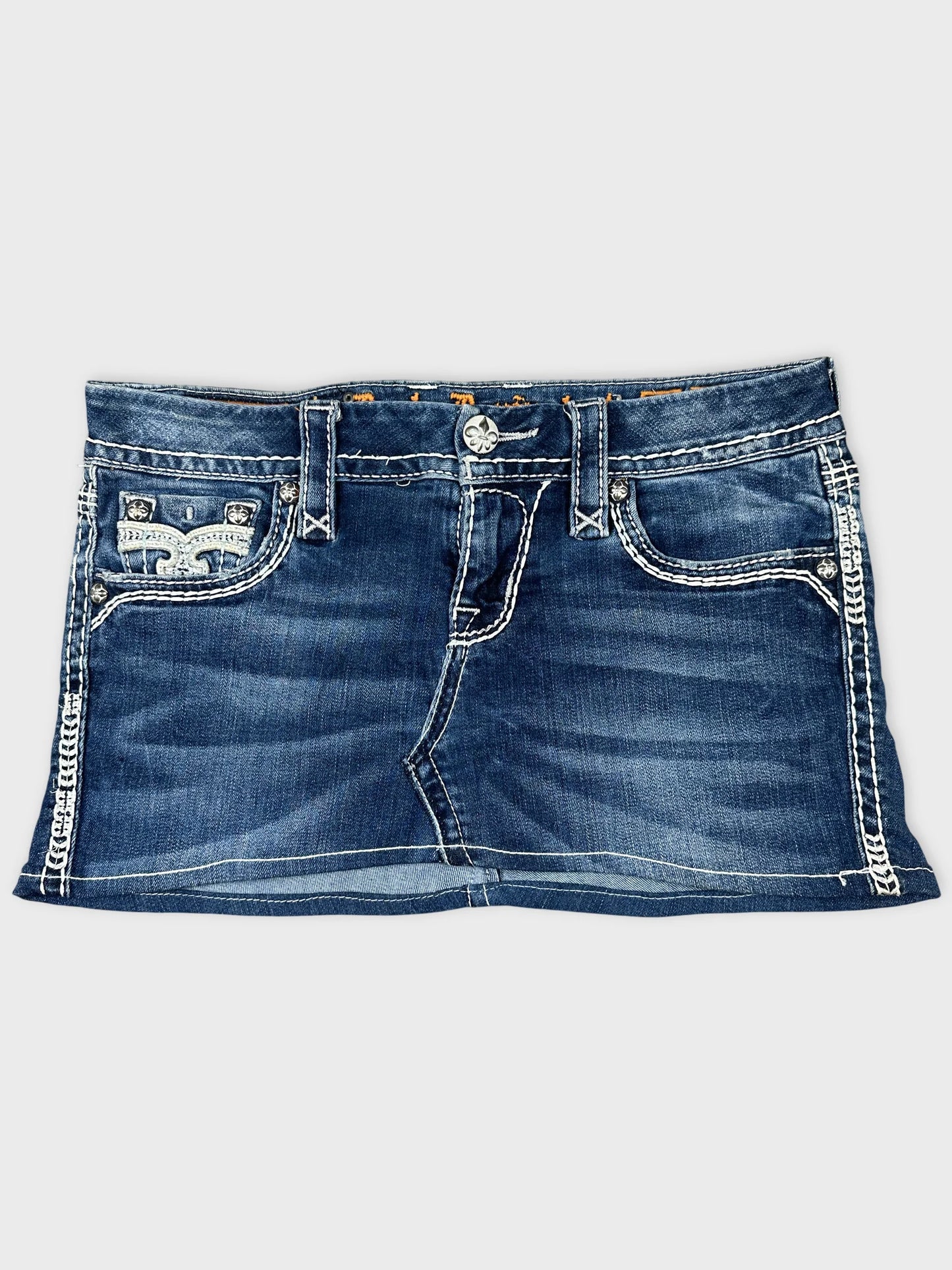 Front view of a blue denim mini skirt featuring decorative stitching details.