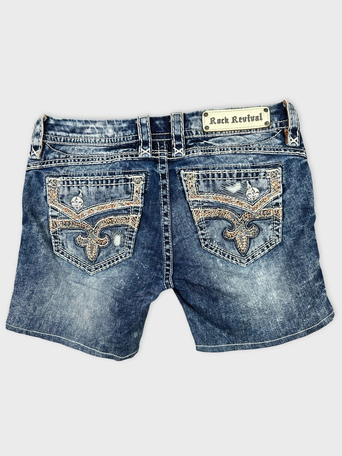 Back view of denim shorts with decorative stitching and pocket details.