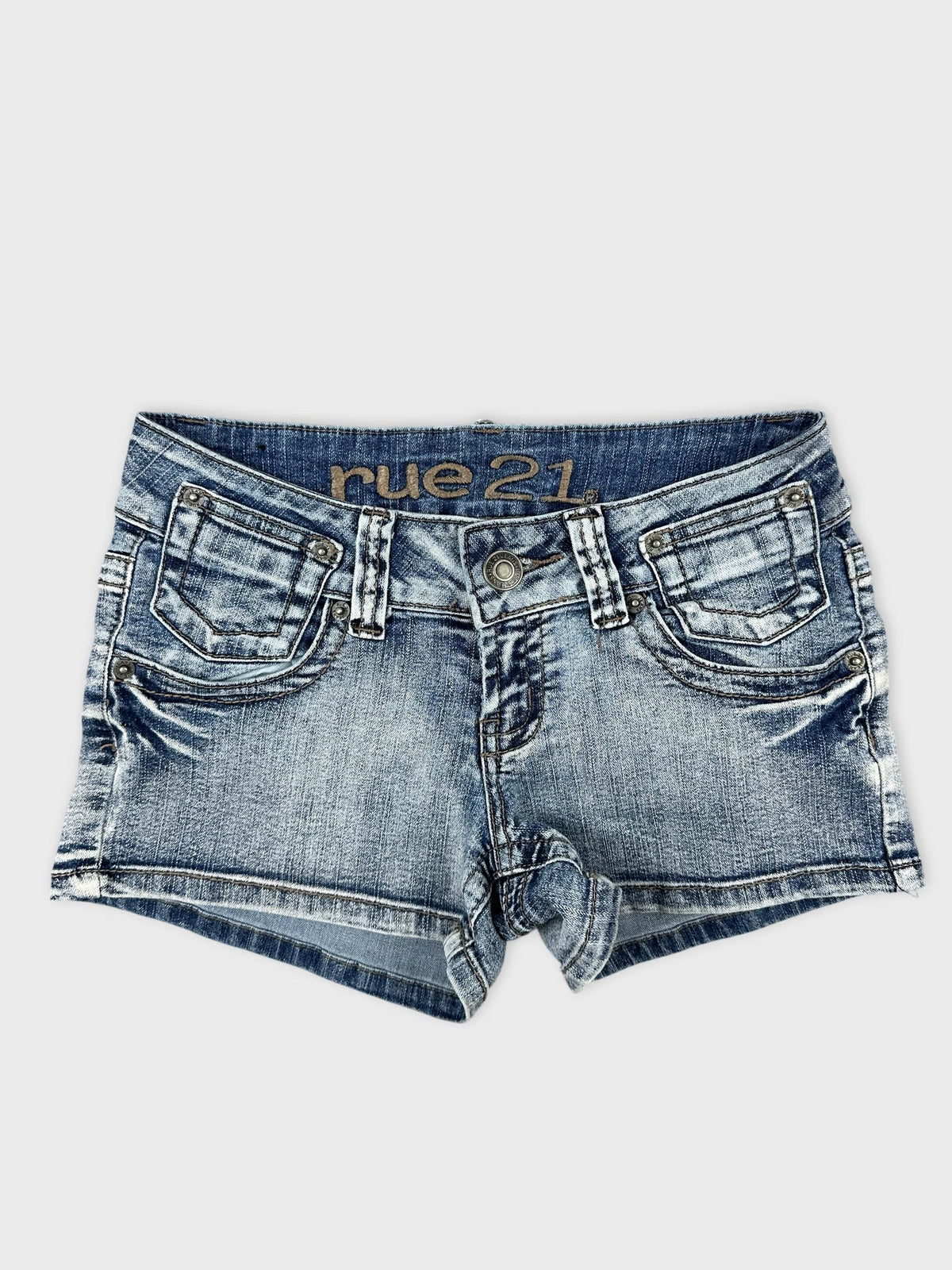 Front view of denim shorts featuring distressed details and a faded wash.