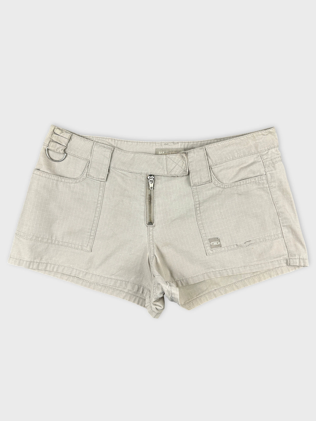 Front view of vintage women's jean shorts in light grey with zipper detail.