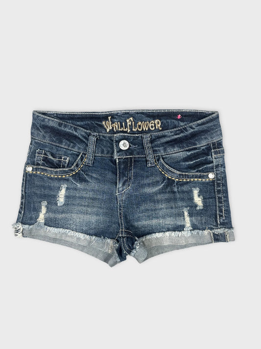 Front view of denim shorts with distressed details in dark blue.