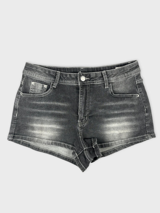 front view of black denim shorts with distressed detailing and hem