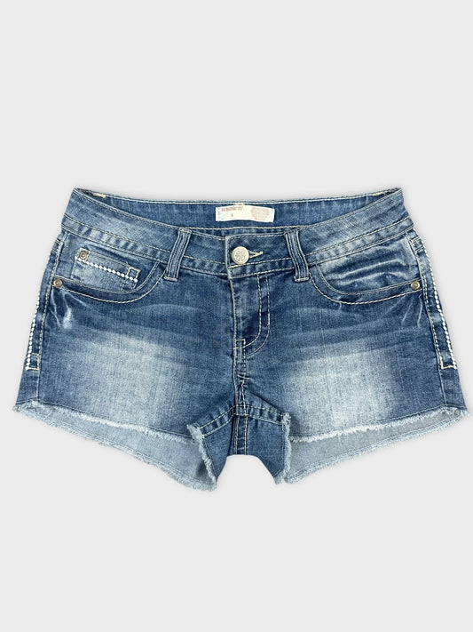 Front view of blue denim shorts with frayed hem and pockets.