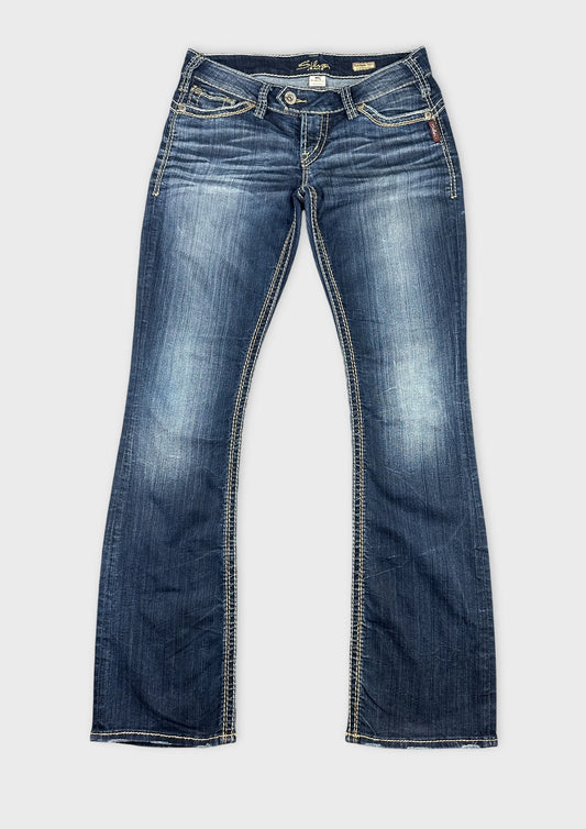 Front view of blue denim jeans with contrast stitching details.
