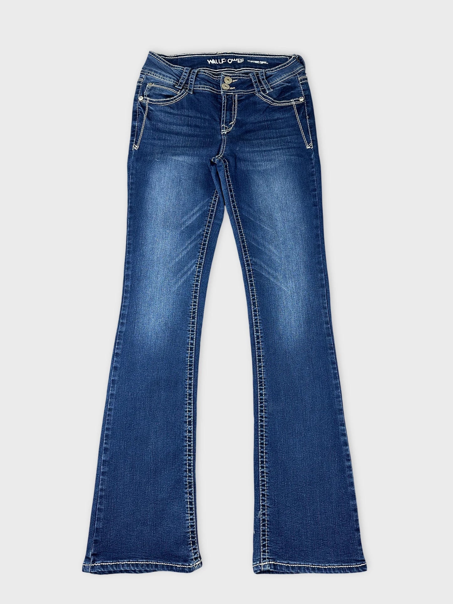 Front view of flared blue jeans with visible stitching details.