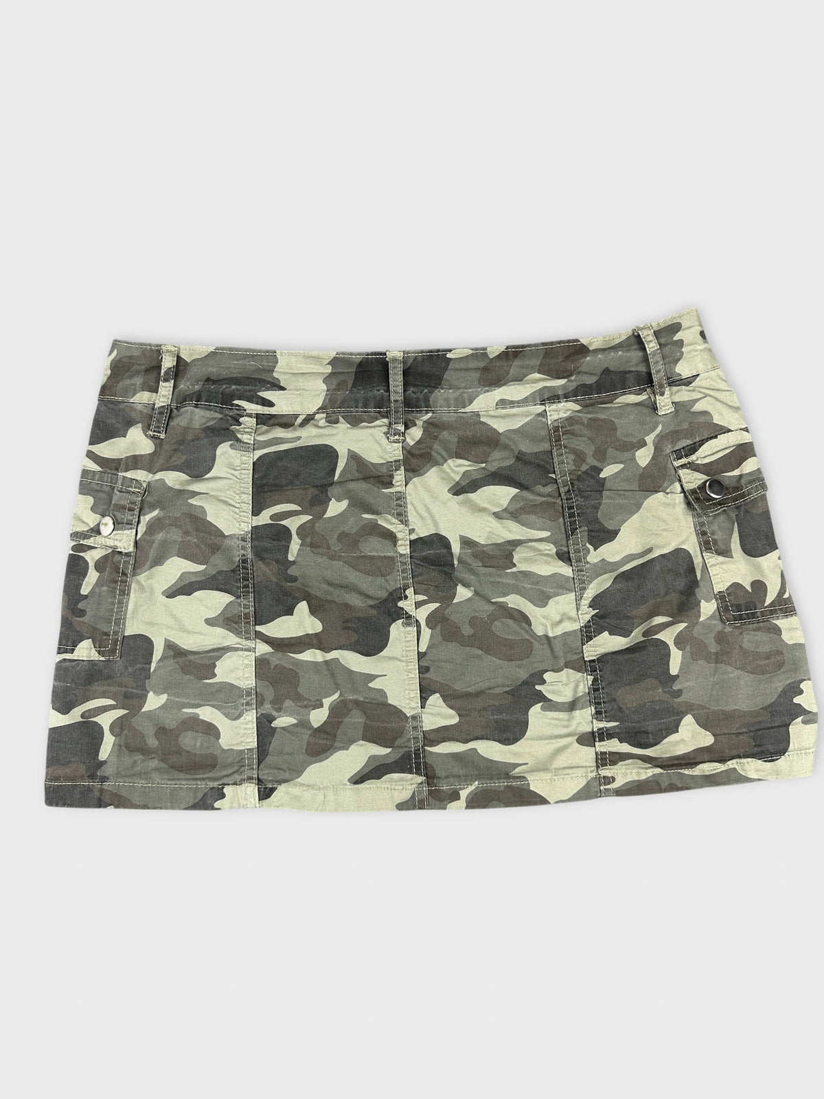 Back view of camouflage skirt featuring pockets and a fitted shape.