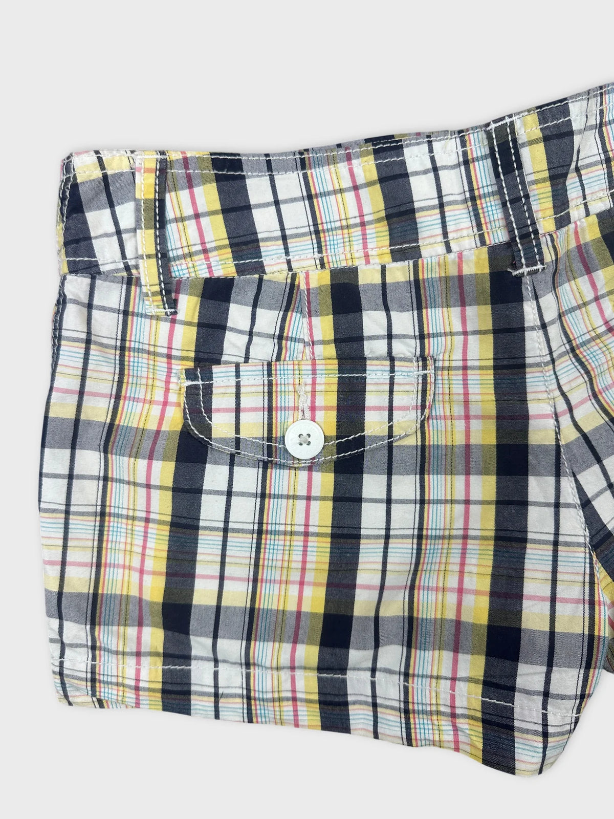 Detail view of women's shorts in colorful plaid pattern