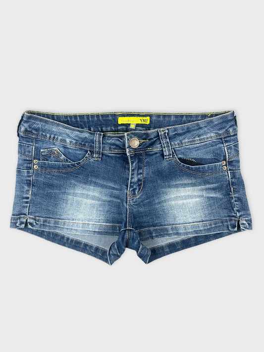 Front view of denim shorts in a light blue wash with back pockets.