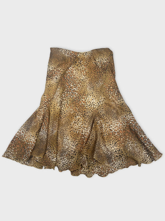 Back view of a brown leopard print skirt with flared hem
