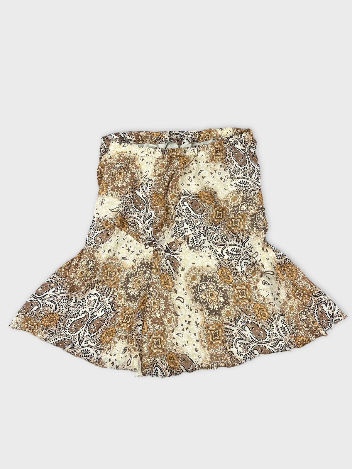 Back view of a vintage skirt featuring a brown and cream paisley pattern.