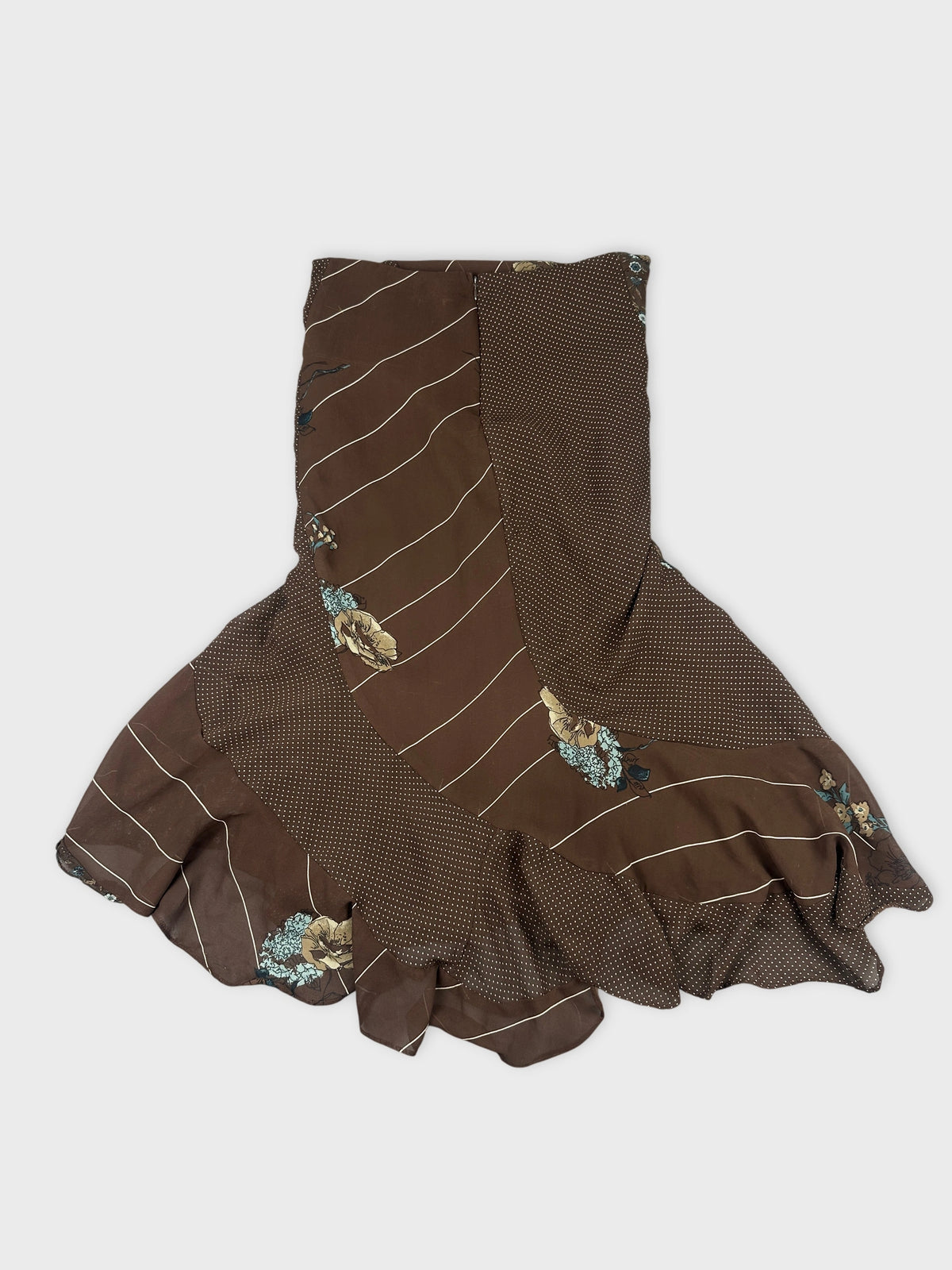 Back view of a brown ruffled skirt with floral print and stripes