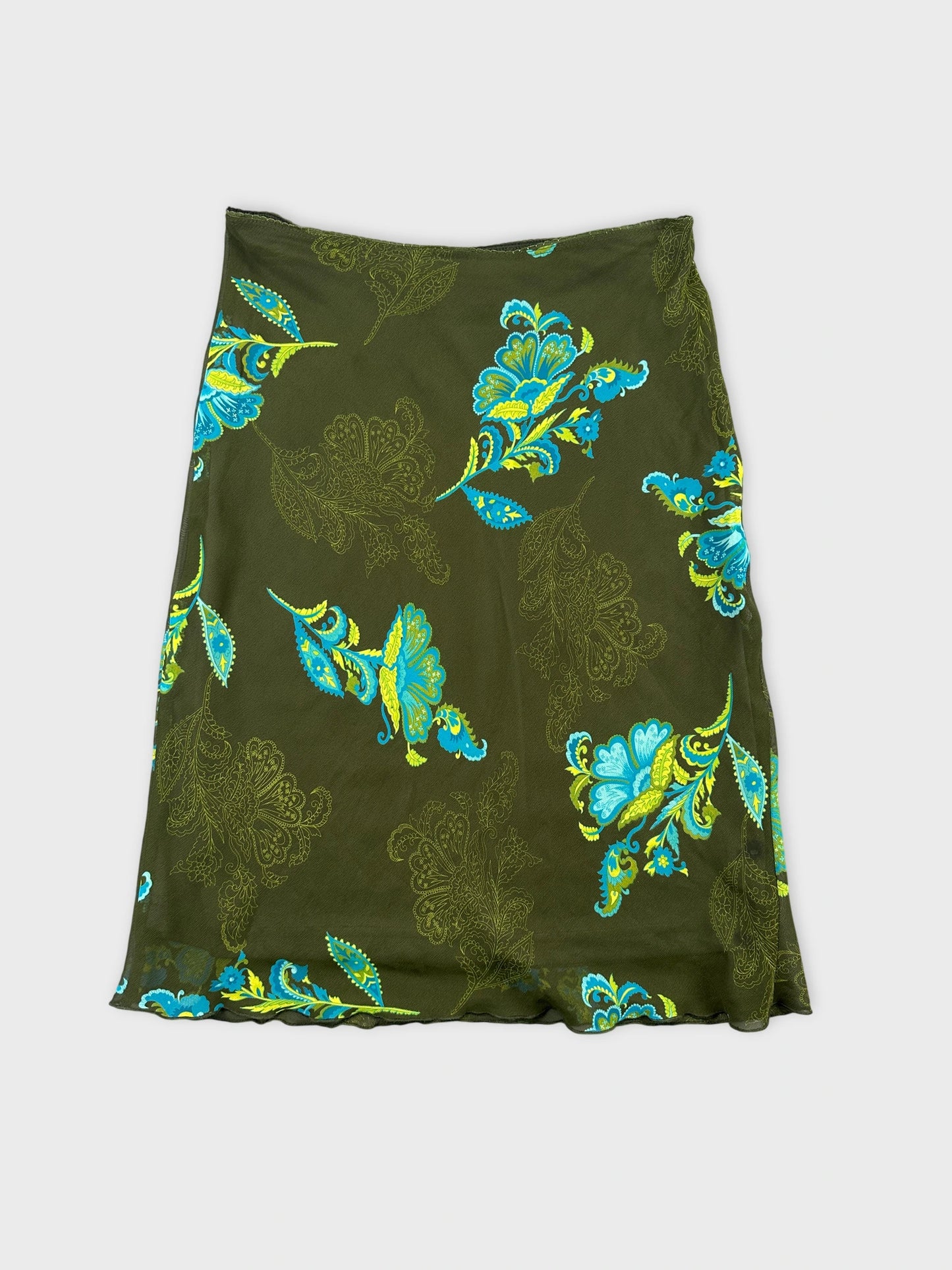 Back view of a green skirt with a floral print in blue and yellow.